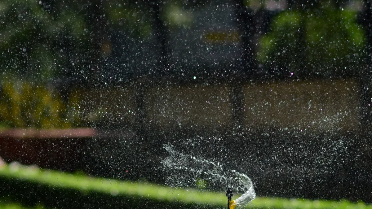 Best Sprinkler Head Types for Lawns, Beds, and Slopes Best Sprinkler Head Types for Lawns, Beds, and Slopes — Garden Sprinkler Spraying Water on Lawn