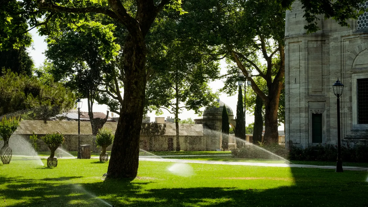 DIY Irrigation Installation vs Hiring a Professional DIY Irrigation Installation vs Hiring a Professional — Water Sprinklers on Grass Field outside a Building