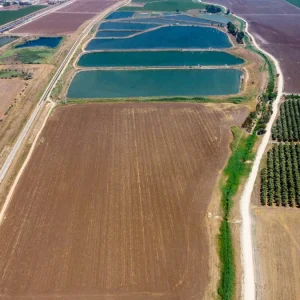 Aerial farm fields with water reservoirs